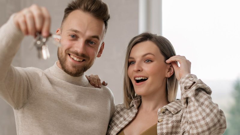 Couple with new-home keys